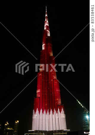 Night view to Burj Khalifa skyscraper in Dubai , flag of Qatar, UAE Night view to Burj Khalifa skyscraper in Dubai , flag of Qatar, UAE 83538461