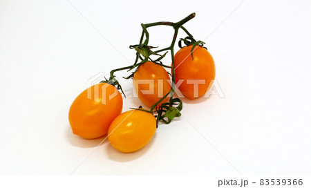 yellow tomato on white isolated background. 83539366