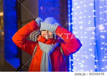 Girl in a night city snowflake Christmas city lights. Christmas and winter holidays concept. 83540476