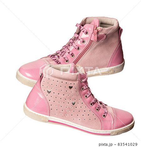 Children's sneakers are pink on a white background. Sports and casual shoes 83541029