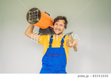 Male foreman for installing stretch ceilings with air heater Male foreman for installing stretch ceilings with air heater 83541030