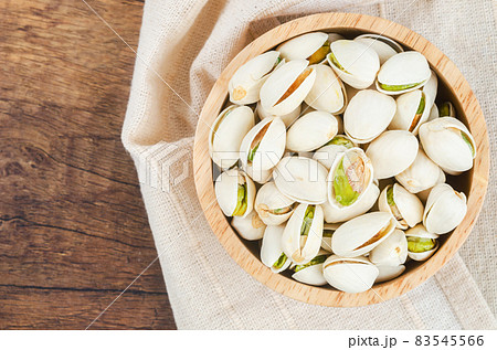 pistachio in shell nuts in bowl. pistachio in shell nuts in bowl. 83545566