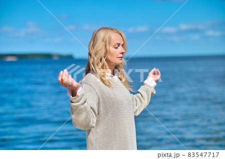Woman alone with thoughts and nature Woman alone with thoughts and nature 83547717