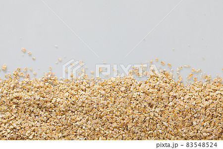 Dry oatmeal background on white surface , nobody 83548524