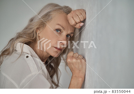 Cheerless woman staring in front of her 83550044