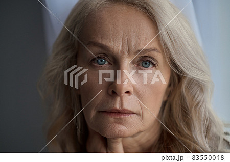 Depressed mature lady posing for the camera Depressed mature lady posing for the camera 83550048