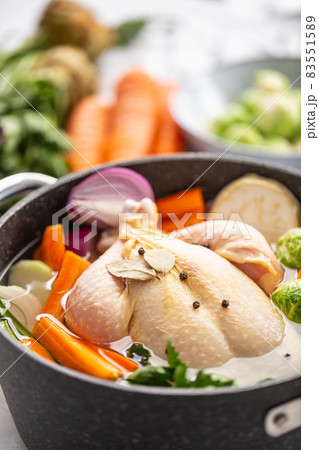 Chicken ready to cook broth with fresh root vegetables and spices 83551589