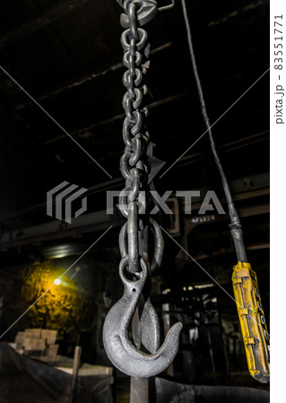 Remote control old control panel lifting industrial mechanism iron hook in the workshop of the industrial plant Remote control old control panel lifting industrial mechanism iron hook in the workshop of the industrial plant 83551771