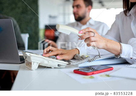 Side view cropped photo of business woman operator wearing formal wear using landline phone 83553228