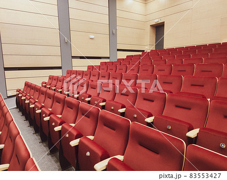 Rows of empty red seats in a theater, coronavirus lockdown 83553427