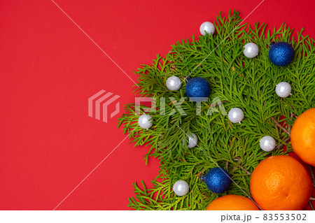 A beautiful New Year's composition on a red background. New Year and Christmas A beautiful New Year's composition on a red background. New Year and Christmas 83553502