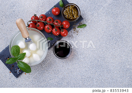 Mozzarella cheese, basil and tomato cherry 83553943