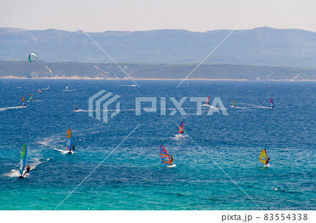 Windsurfers on water of Bol gulf Brac island, Adriatic sea, Croatia 83554338