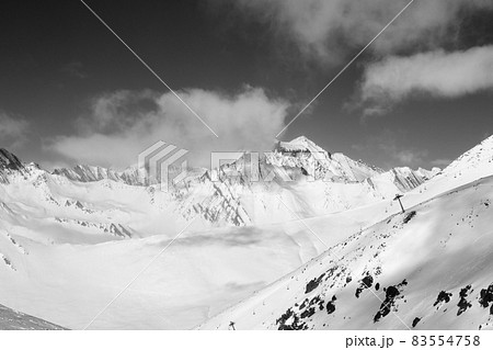 Black and white off-piste slope and chair-lift on ski resort at sun day 83554758