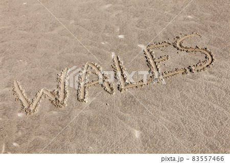 Wales sand background of handwritten text Wales sand background of handwritten text 83557466
