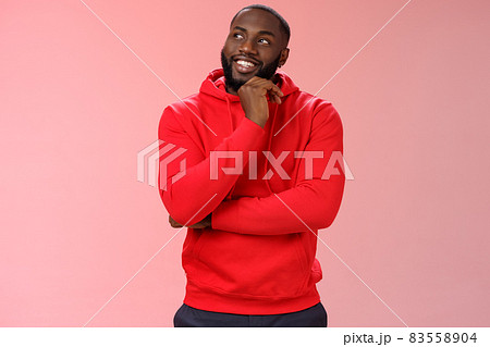 Inetersted successful young black sportsman considering take opportunity look curious upper left corner thinking touch chin thoughtful, make decision choosing what pick, pink background Inetersted successful young black sportsman considering take opportunity look curious upper left corner thinking touch chin thoughtful, make decision choosing what pick, pink background 83558904