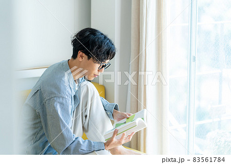 Young Men Reading Stock Photo