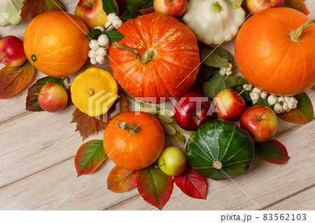 Fall orange, red, green pumpkin and leaves top view Fall orange, red, green pumpkin and leaves top view 83562103