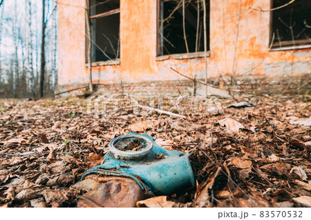 Gasmask Near Abandoned Ruined Old Village School Building In Chernobyl Resettlement Zone. Belarus. Chornobyl Catastrophe Disasters. Dilapidated House In Belarusian Village. Whole Villages Must Be 83570532