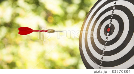 New Target and goal as concept, Close up shot of the dart arrow hit on bullseye, red dart arrow hitting in the target center of dartboard Target hit in the center, challenge in business marketing. 83570804