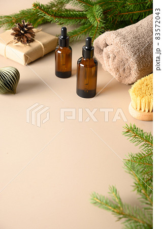Christmas Spa concept with gift, wellness objects, cosmetic oil for relax. 83572043