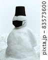 Snowman in black face mask 83573600