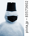 Snowman in black face mask. Concept of virus quarantine. 83573602