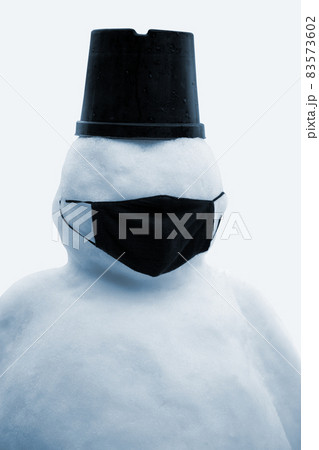 Snowman in black face mask. Concept of virus quarantine. Snowman in black face mask. Concept of virus quarantine. 83573602