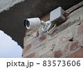 IP CCTV camera mounted on the wall of the house 83573606