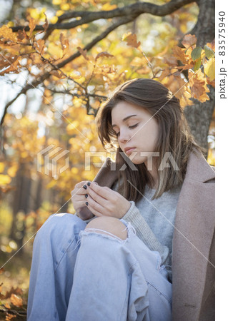 Young teenager girl in the autumn forest 83575940