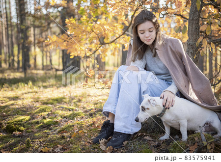 Beautiful Young Girl With Her Dog In The Forest Beautiful Young Girl With Her Dog In The Forest 83575941