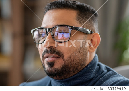 Head of mature man in eyeglasses sitting in front of laptop Head of mature man in eyeglasses sitting in front of laptop 83579910