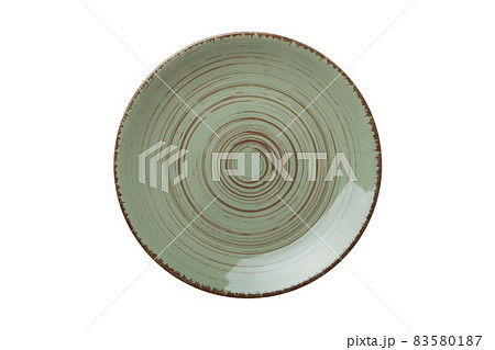 Green ceramic round plate isolated over white background. Top view Green ceramic round plate isolated over white background. Top view 83580187