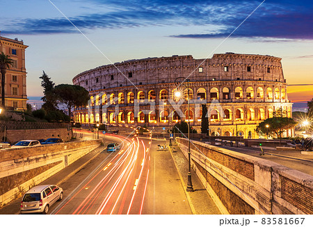 Beautiful view on Colosseum and a road nearby at sunset, Rome, Italy 83581667