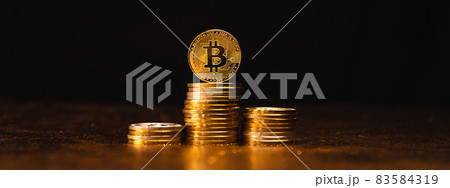 Cryptocurrency Growth Over Stacked Gold Bitcoin Coins Cryptocurrency Growth Over Stacked Gold Bitcoin Coins 83584319