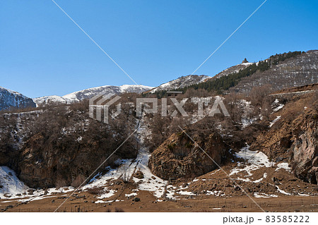 Gergeti Orthodox Church of the Holy Trinity in the mountains of Georgia. An authentic spiritual place Gergeti Orthodox Church of the Holy Trinity in the mountains of Georgia. An authentic spiritual place 83585222