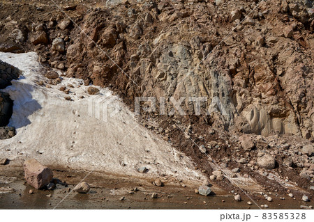 Early spring in the mountains. The rocks fell on the road. Dangerous bugle road. Rockfall in the mountains Early spring in the mountains. The rocks fell on the road. Dangerous bugle road. Rockfall in the mountains 83585328