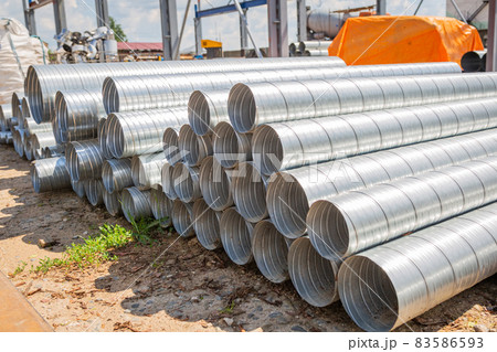 Ventilation pipe warehouse. Steel pipes, parts for the construction of air ducts for an industrial Ventilation pipe warehouse. Steel pipes, parts for the construction of air ducts for an industrial 83586593