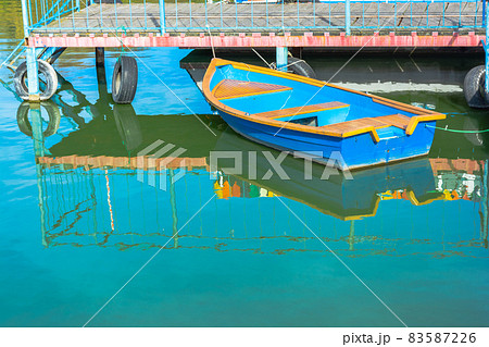 Blue one boat near the metal pier. Blue one boat near the metal pier. 83587226