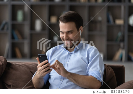 Happy millennial man holding video call conversation. Happy millennial man holding video call conversation. 83588176