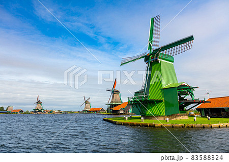 Famous Dutch village with windmills, Agricultural historical landscape. Tourism. Popular Holland, Netherlands, Europe. 83588324