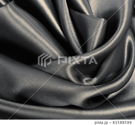 Smooth elegant brown silk or satin texture as abstract background. Luxurious background design. In Sepia toned. Retro style Smooth elegant brown silk or satin texture as abstract background. Luxurious background design. In Sepia toned. Retro style 83588599