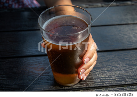 Refreshing apple cider. Woman's hand with polished and varnished nails Refreshing apple cider. Woman's hand with polished and varnished nails 83588808