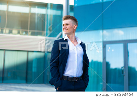 Business. Businessman Standing City Street Near Office Building . 83593454