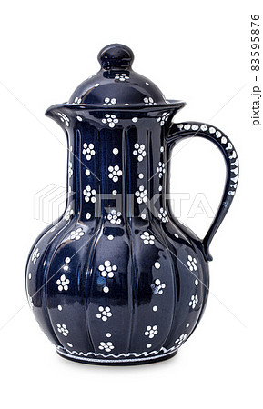 Blue antique pottery pitcher isolated on white background Blue antique pottery pitcher isolated on white background 83595876