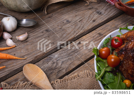 Composition of autumn halloween food harvest with copy space on wooden background Composition of autumn halloween food harvest with copy space on wooden background 83598651