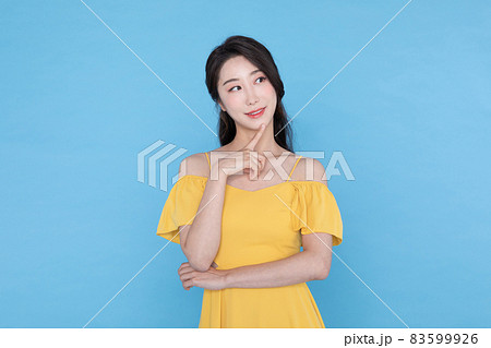 shopping event concept, smiling beautiful Korean Asian woman with hand near face 83599926