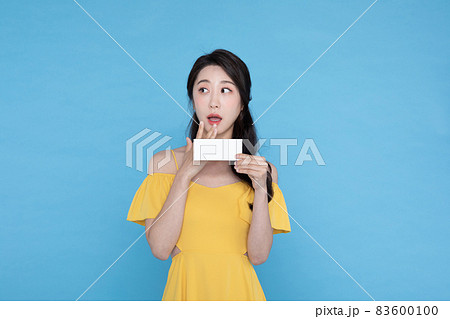 shopping event concept, beautiful Korean Asian woman with coupon shopping event concept, beautiful Korean Asian woman with coupon 83600100