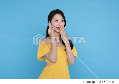 shopping event concept, beautiful Korean Asian woman surpised after receiving smart phone shopping event concept, beautiful Korean Asian woman surpised after receiving smart phone 83600101
