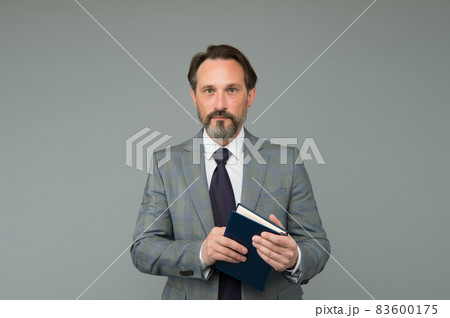 Making business notes. Bearded man hold book. Making business notes. Bearded man hold book. 83600175
